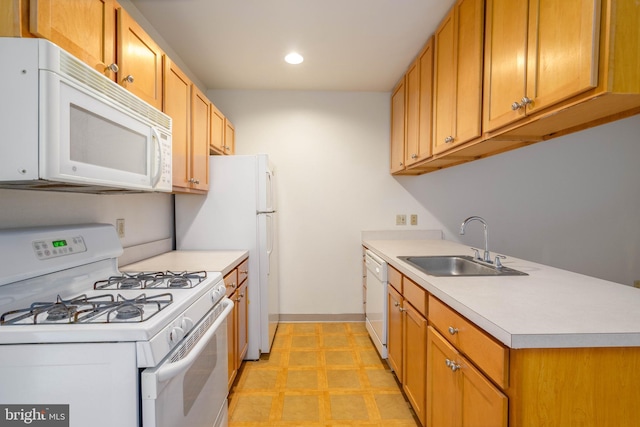 kitchen featuring sink and white appliances