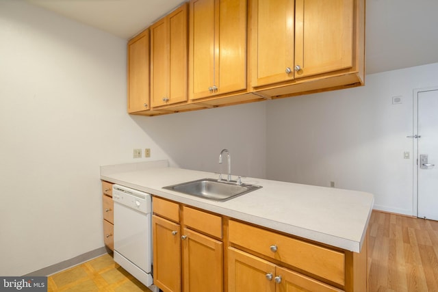 kitchen with light hardwood / wood-style floors, sink, white dishwasher, and kitchen peninsula