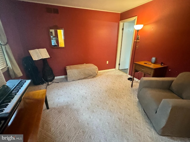 living room featuring ornamental molding and light carpet