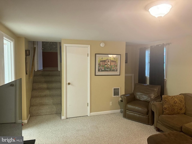 living room featuring light colored carpet