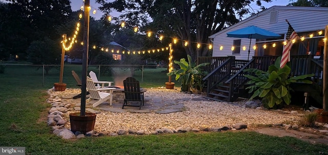 wooden deck with a lawn