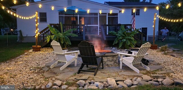 deck featuring a shed and a lawn