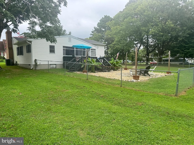 view of yard featuring central air condition unit