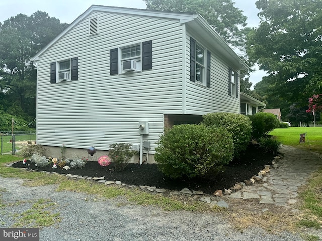 view of home's exterior with cooling unit