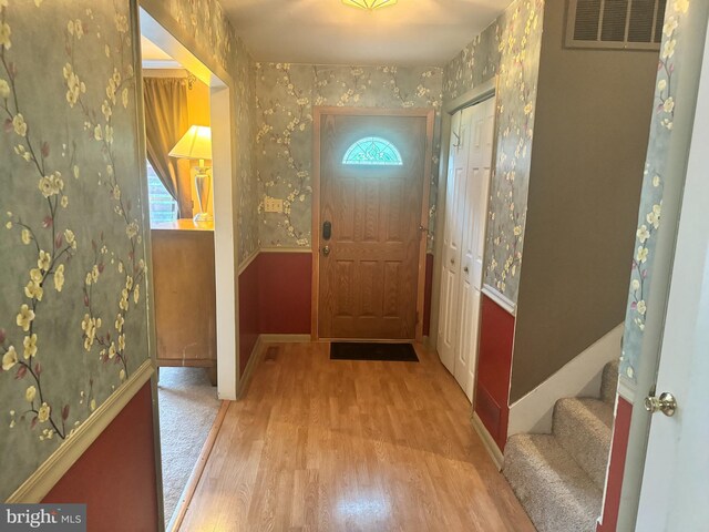 doorway to outside featuring light hardwood / wood-style flooring and plenty of natural light