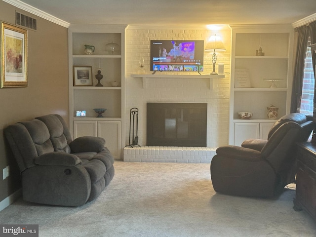 living room featuring built in shelves, a fireplace, crown molding, and carpet