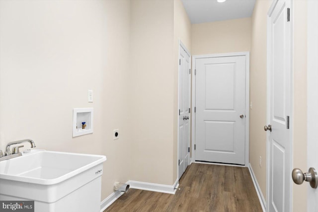 laundry room featuring sink, electric dryer hookup, wood-type flooring, and hookup for a washing machine