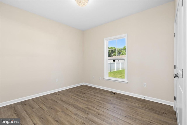 empty room featuring hardwood / wood-style flooring