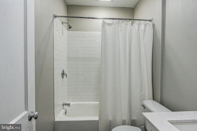 full bathroom featuring vanity, shower / bathtub combination with curtain, and toilet