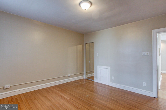 unfurnished room featuring light hardwood / wood-style flooring