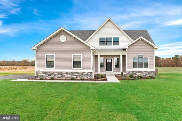 craftsman house featuring a front yard and covered porch