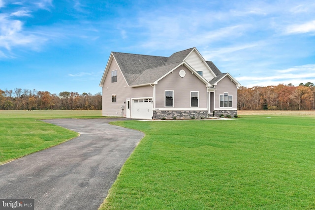 view of front facade with a garage and a front lawn