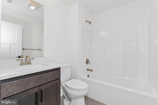 full bathroom featuring tile patterned flooring, vanity, toilet, and shower / washtub combination