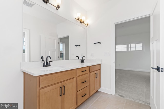 bathroom featuring tile patterned flooring and vanity