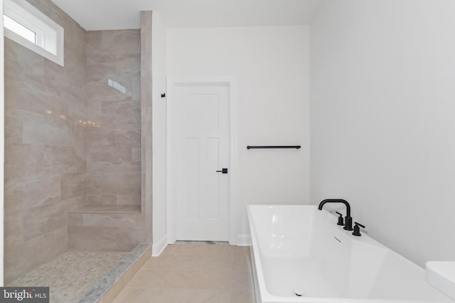 bathroom with independent shower and bath and tile patterned floors