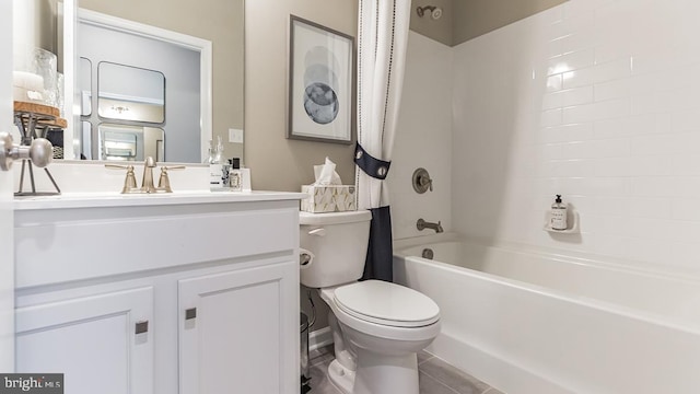 full bathroom featuring vanity, bathtub / shower combination, tile patterned floors, and toilet