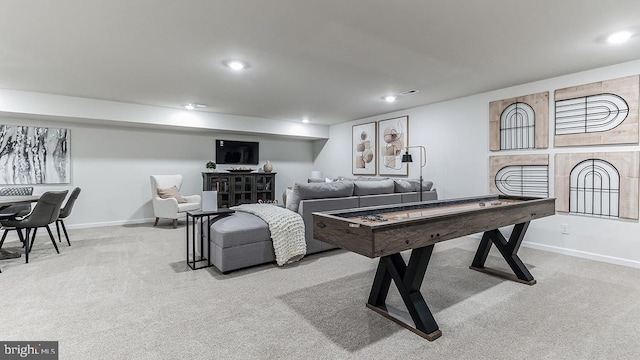 recreation room featuring light colored carpet