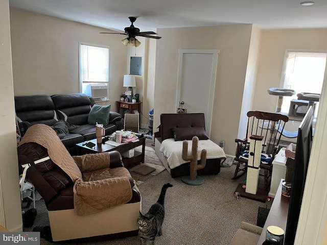 carpeted living room featuring cooling unit, electric panel, and ceiling fan