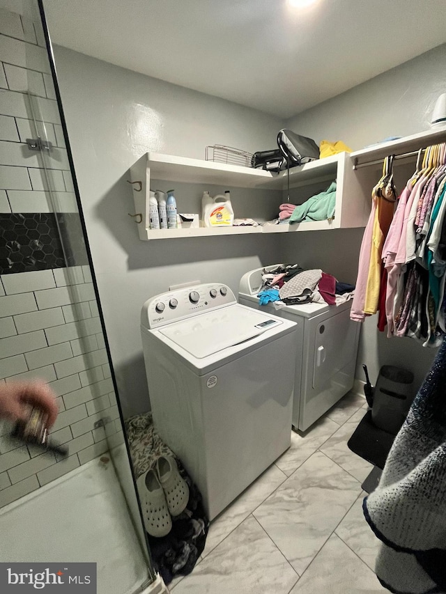 laundry area with separate washer and dryer