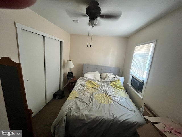 bedroom featuring cooling unit, ceiling fan, carpet, and a closet