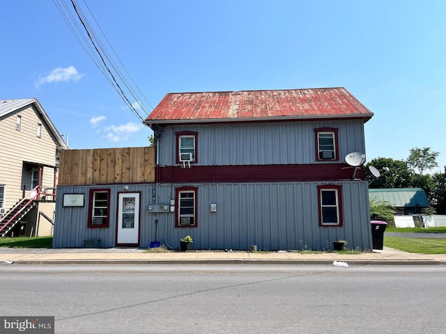 view of front facade featuring cooling unit