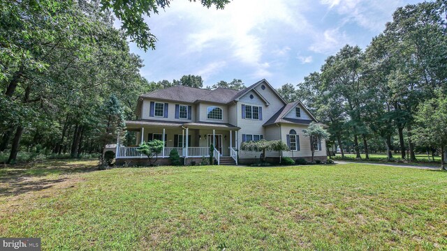 view of front of property with a porch and a front yard