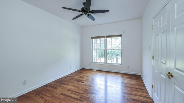 unfurnished bedroom featuring dark hardwood / wood-style floors and ceiling fan