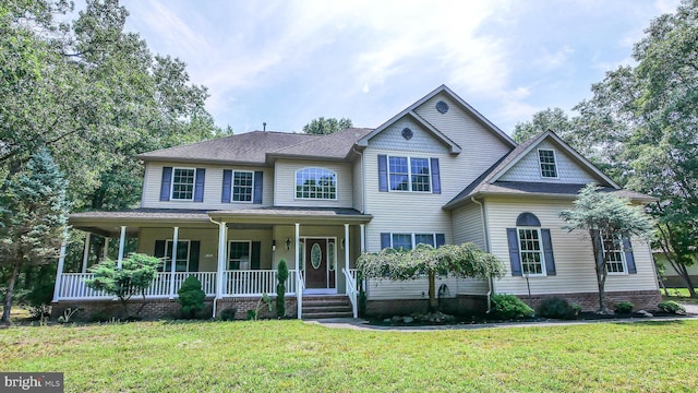 view of front of home with a porch and a front lawn