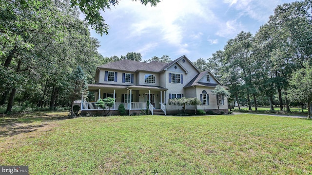 view of front of house with a porch and a front yard