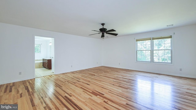 unfurnished room featuring light hardwood / wood-style flooring and ceiling fan