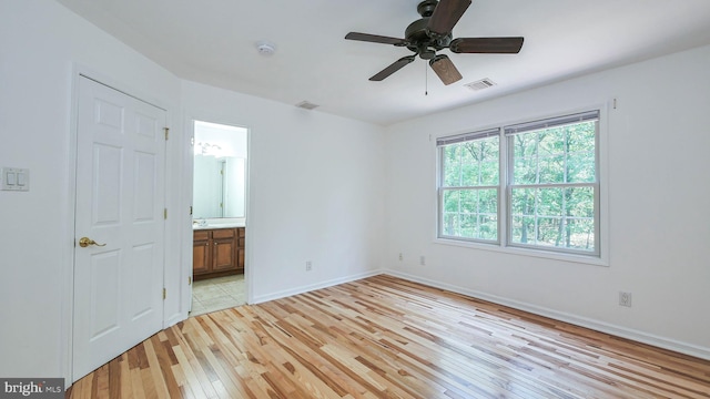 unfurnished room featuring ceiling fan and light hardwood / wood-style flooring