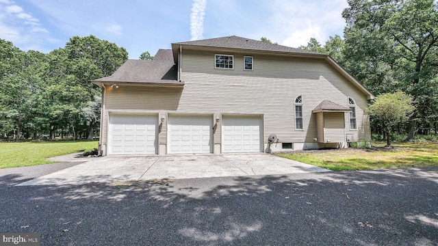 view of property exterior with a garage