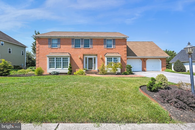 colonial-style house with a garage and a front yard