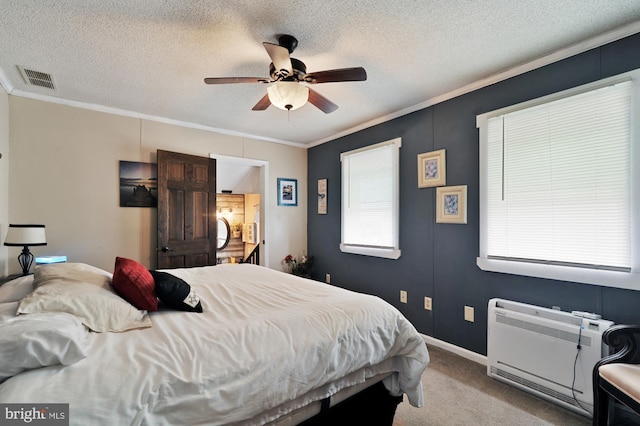 carpeted bedroom with a textured ceiling and ceiling fan