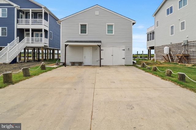 rear view of house featuring a balcony