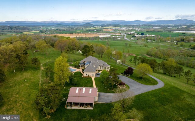 birds eye view of property featuring a mountain view and a rural view