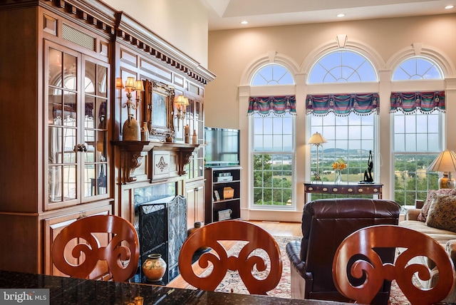 dining room featuring recessed lighting and a fireplace