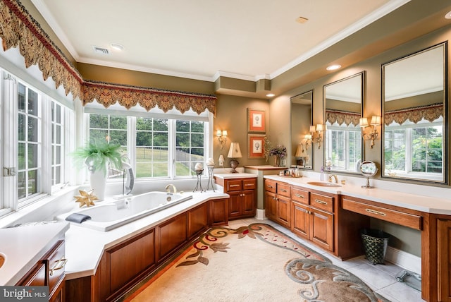 bathroom featuring a tub to relax in, vanity, ornamental molding, and a wealth of natural light