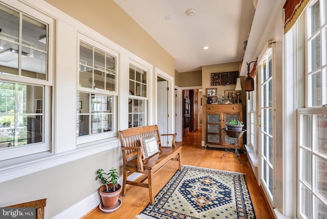 living area with hardwood / wood-style floors