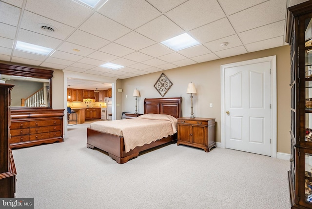 bedroom featuring carpet and a drop ceiling