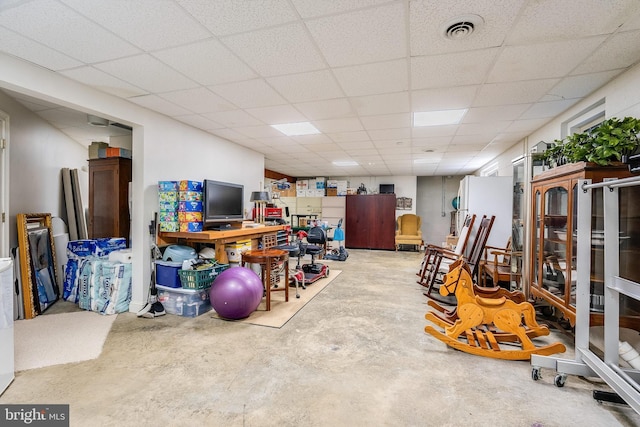 below grade area featuring visible vents and a paneled ceiling