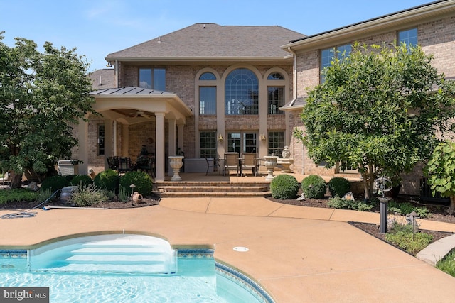 view of pool featuring a patio and ceiling fan