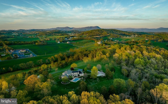 birds eye view of property featuring a mountain view