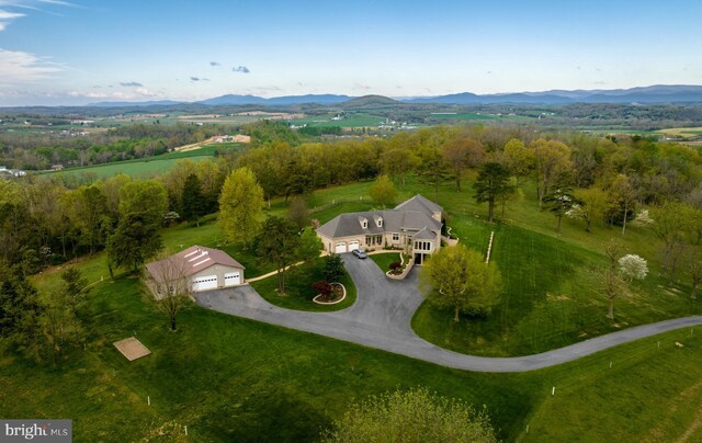 aerial view with a mountain view and a rural view