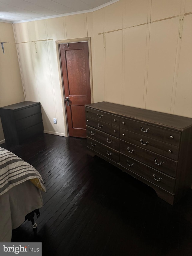 bedroom featuring dark hardwood / wood-style flooring