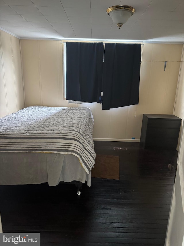 bedroom with hardwood / wood-style floors