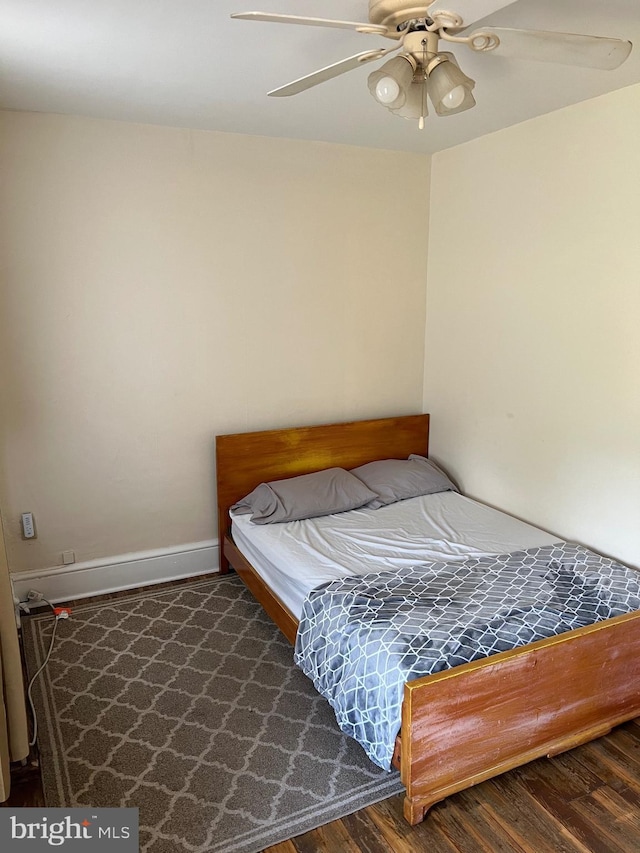 bedroom featuring dark hardwood / wood-style floors and ceiling fan