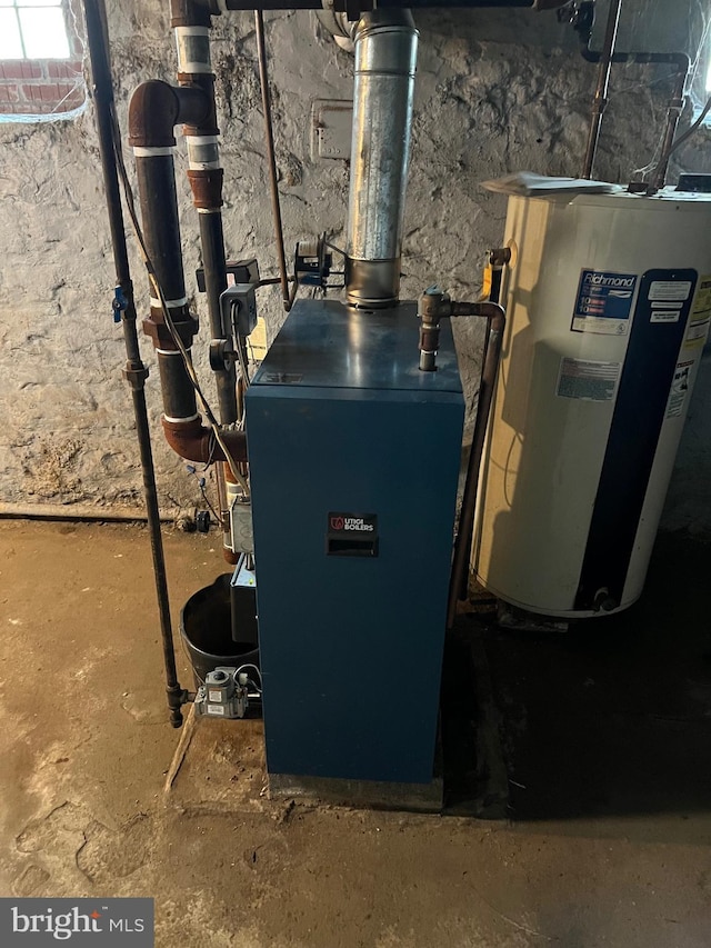 utility room featuring water heater