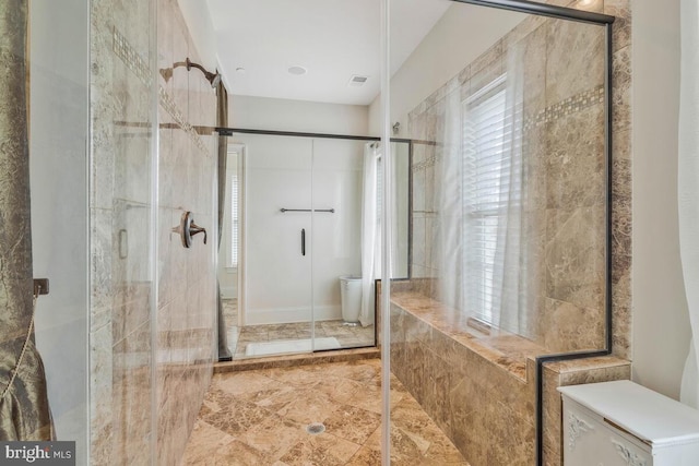 bathroom with walk in shower, toilet, and tile patterned floors