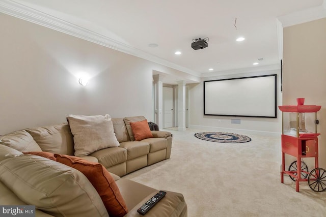 home theater room with light carpet and crown molding